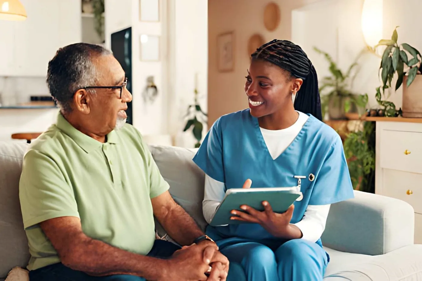 A caregiver and an older adult reviewing a care plan at home